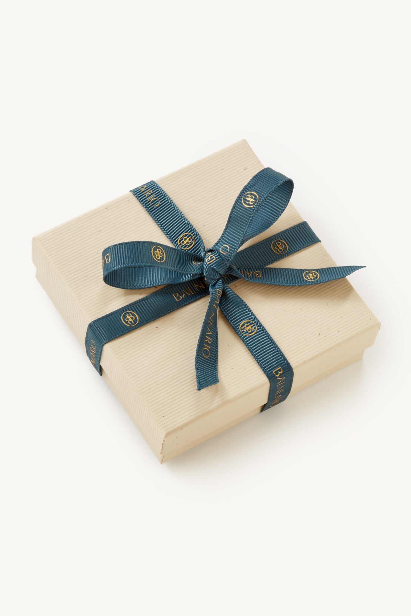 Cream gift box with signature teal Balneario branded ribbon