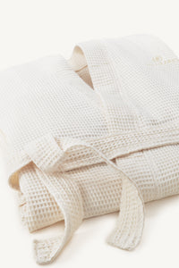 Balneario logo featured on a kimono-style, waffle spa robe