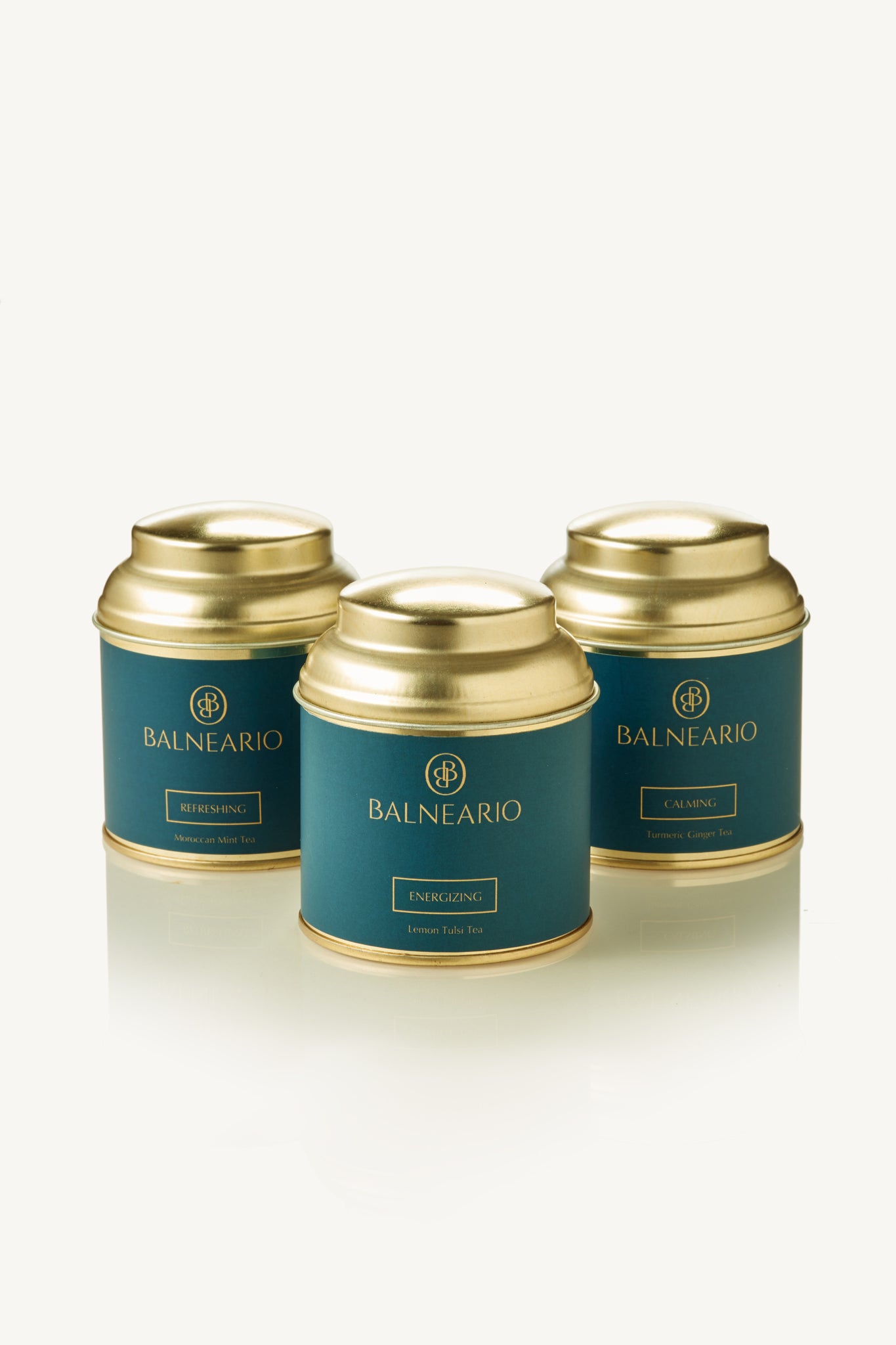 Balneario Wellness Tea Trio in teal tins with gold lids.  